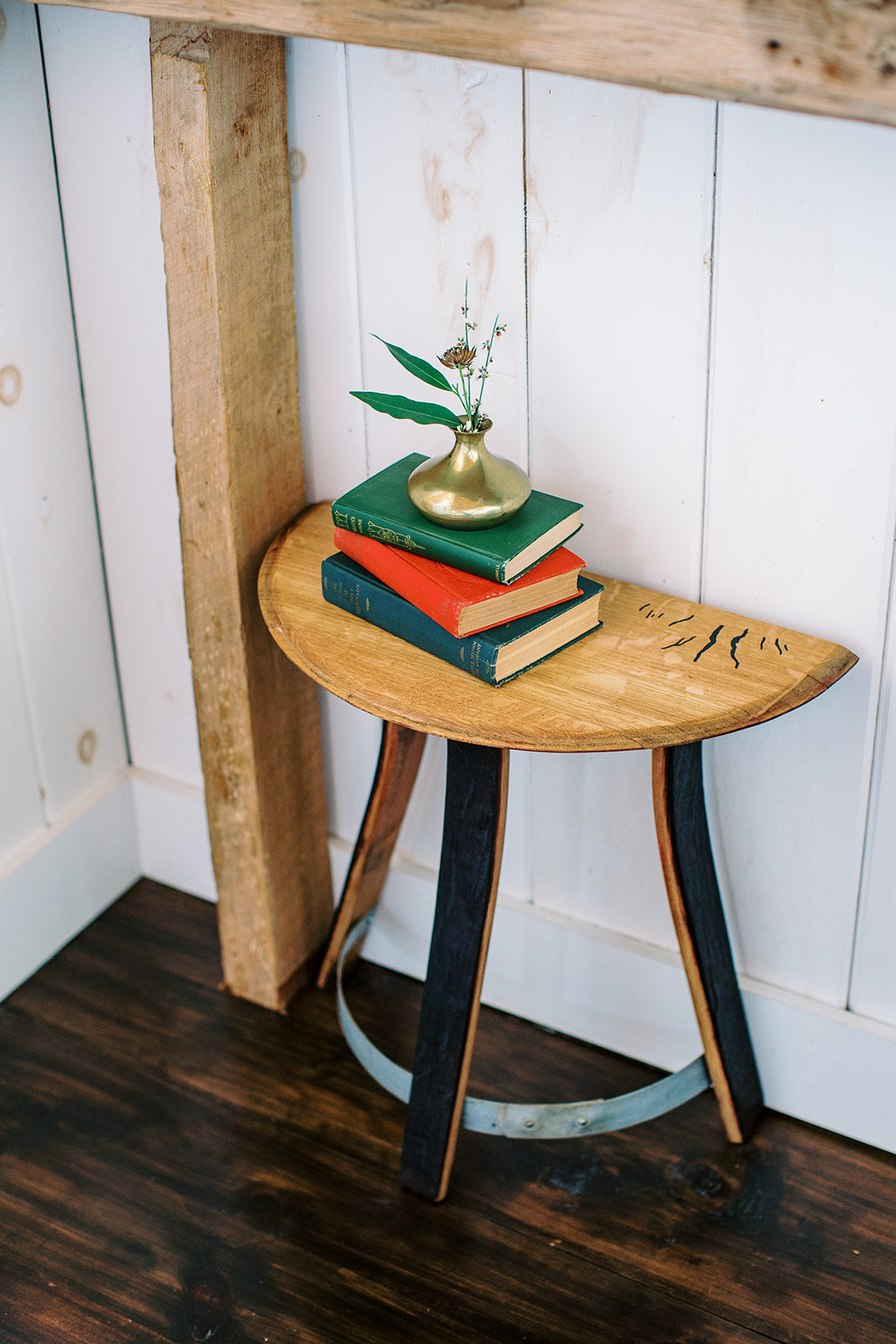 half moon wine barrel table used as an entryway side table